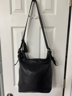 Coach Black Leather Bucket Bag with Adjustable Shoulder Strap and Tassels